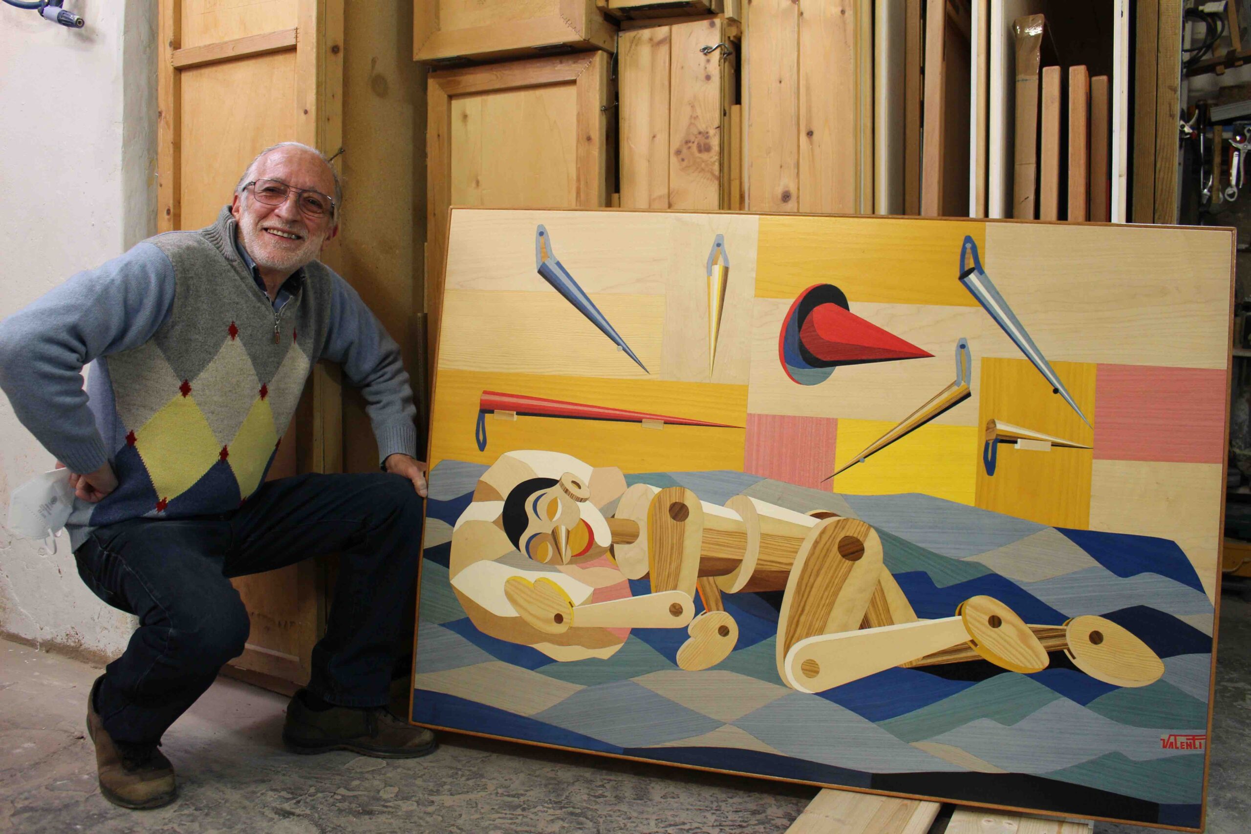 Pino Valenti with the artwork Pinocchio.